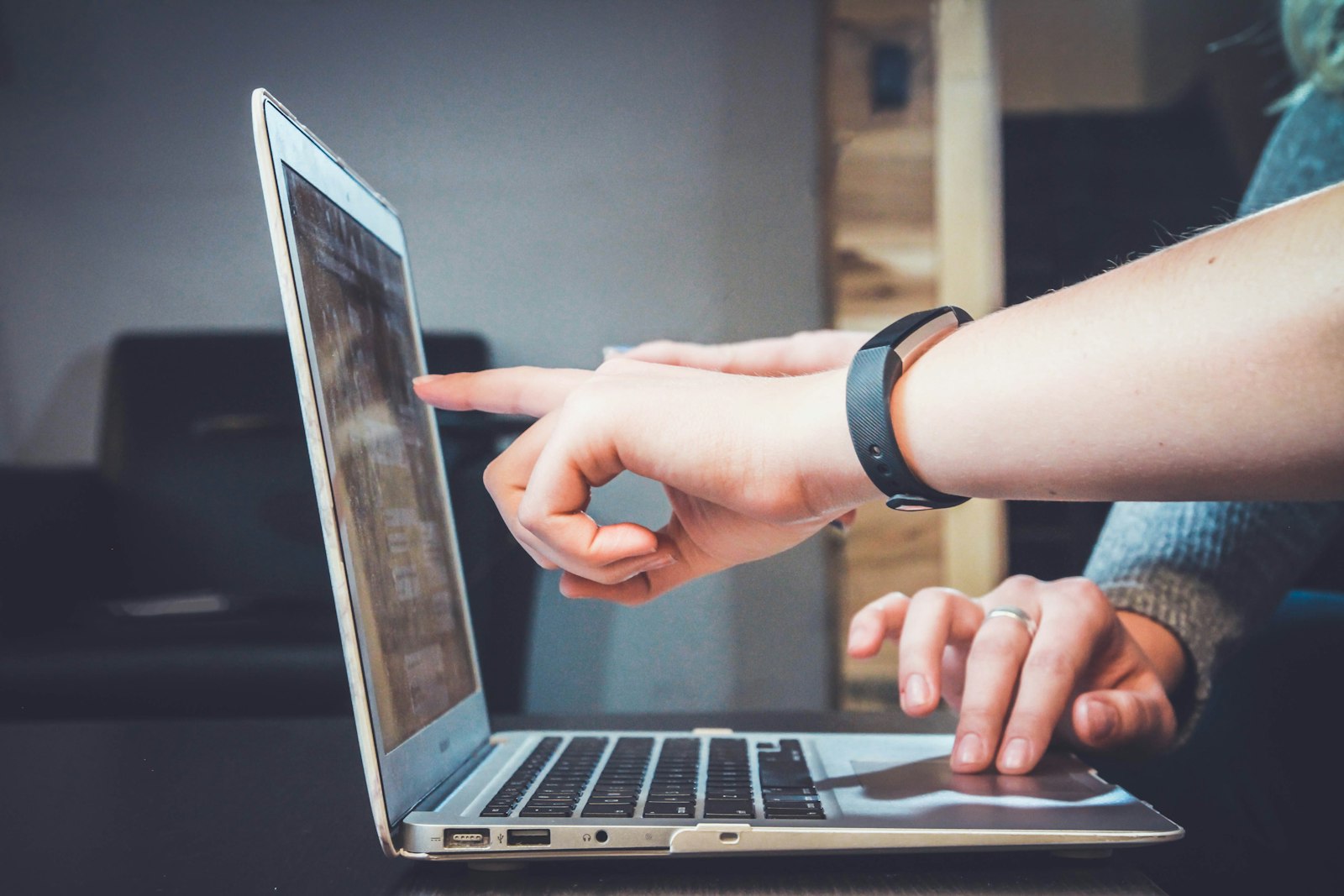 Professional working with laptop in training environment